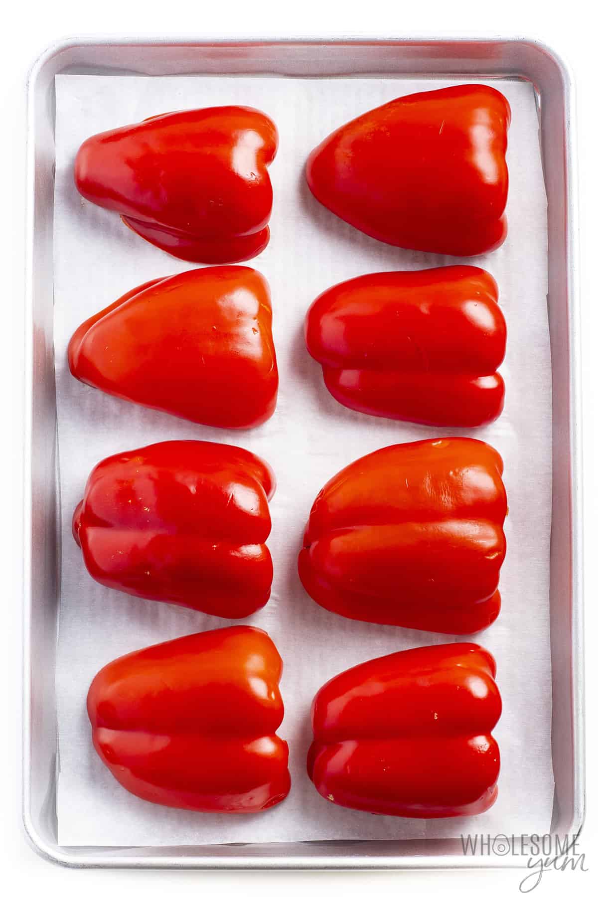 Red peppers on a baking sheet