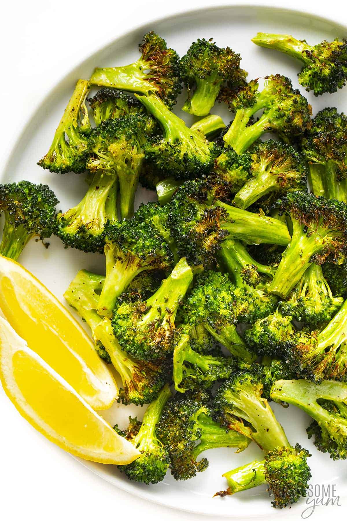 Broccoli and lemon wedges on a plate