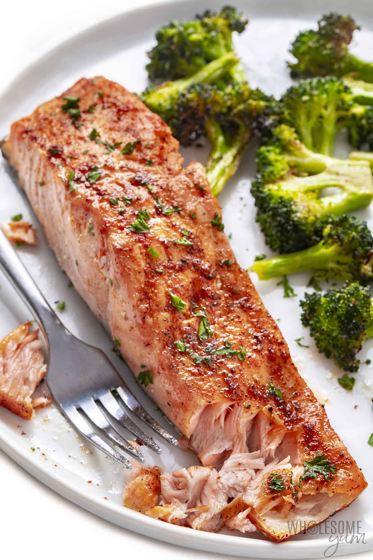Air fryer salmon with fork and broccoli