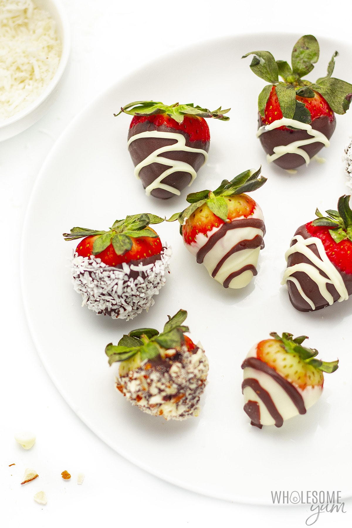 Sugar-free chocolate covered strawberries with nuts and decorations.