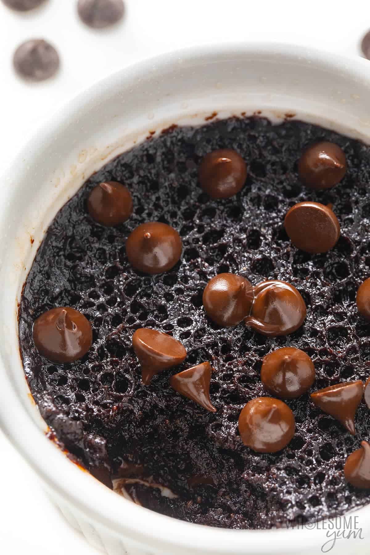 Fully cooked low carb mug brownie in a ramekin