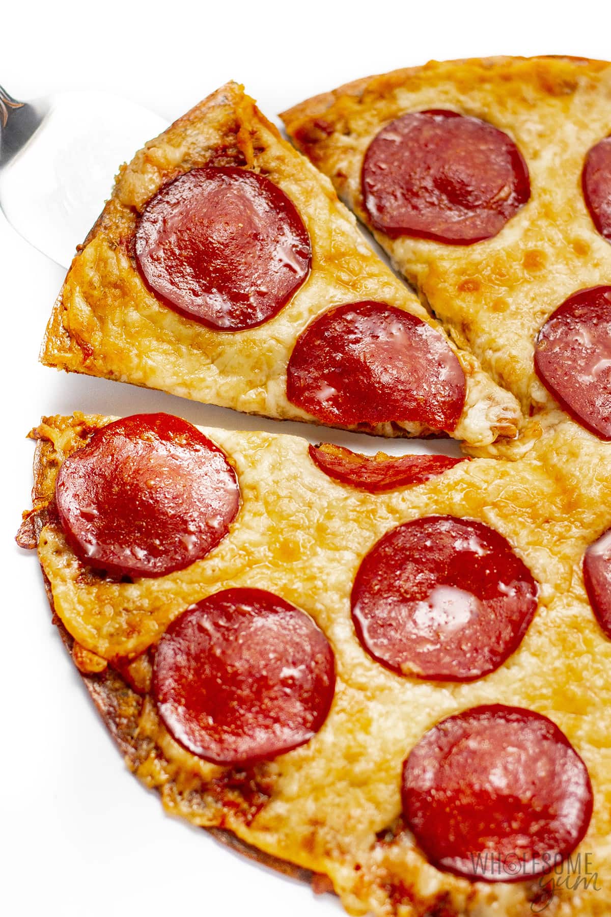 Baked flourless pizza crust with toppings.