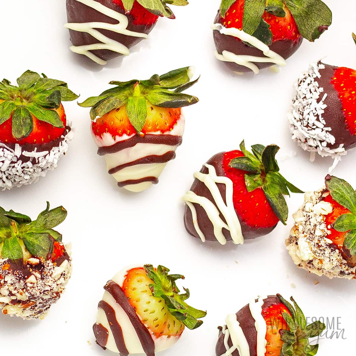 Keto chocolate covered strawberries on a white background.
