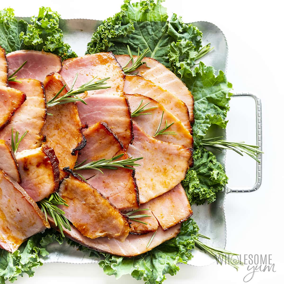 Carved keto friendly ham on a platter.