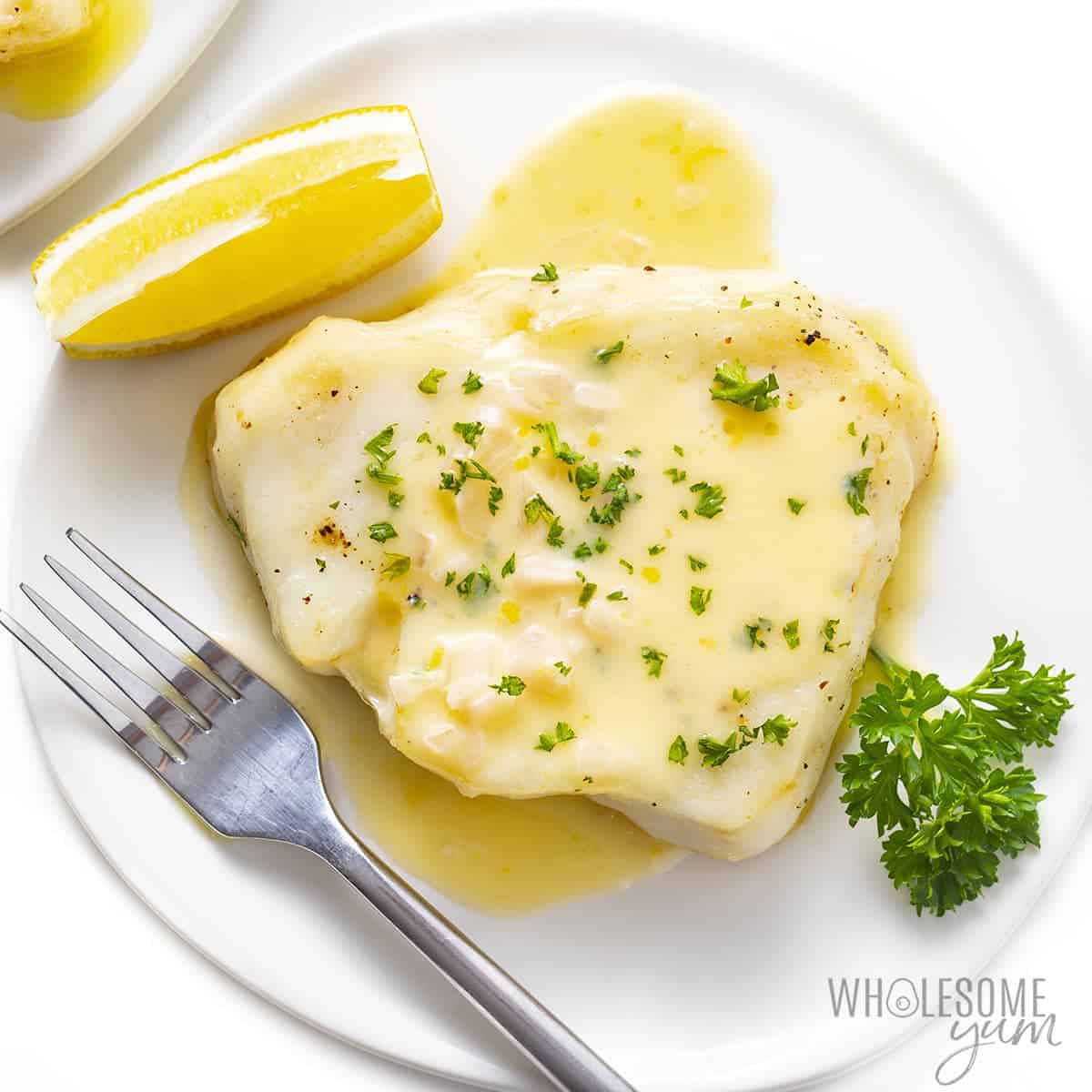 The best Chilean sea bass recipe drizzled with beurre blanc sauce.