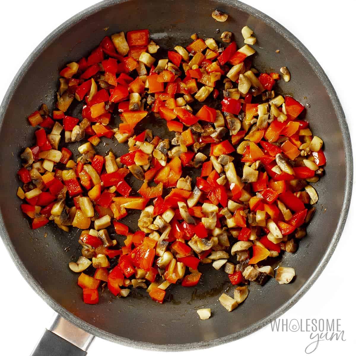 Sauteed vegetables in skillet.
