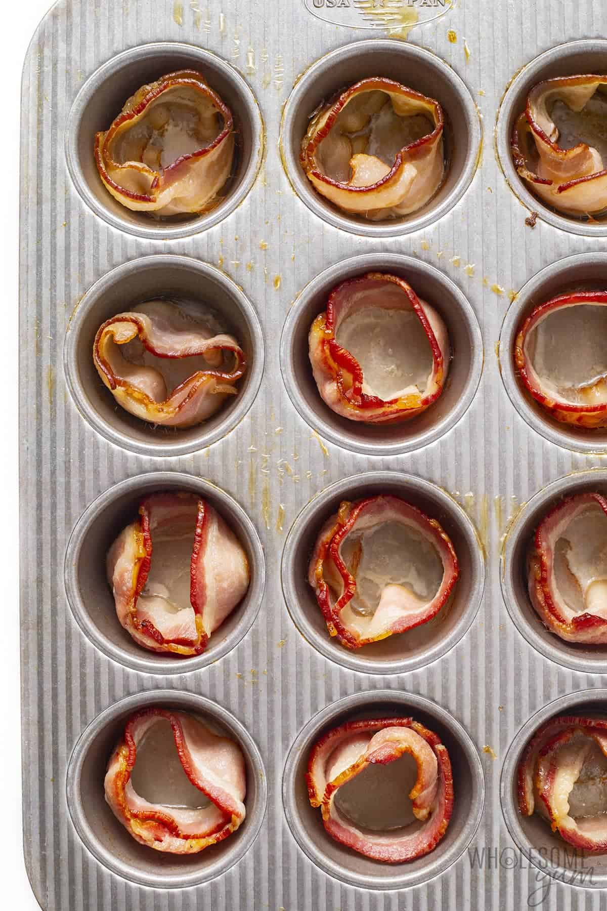 Bacon in muffin cups for baking eggs.