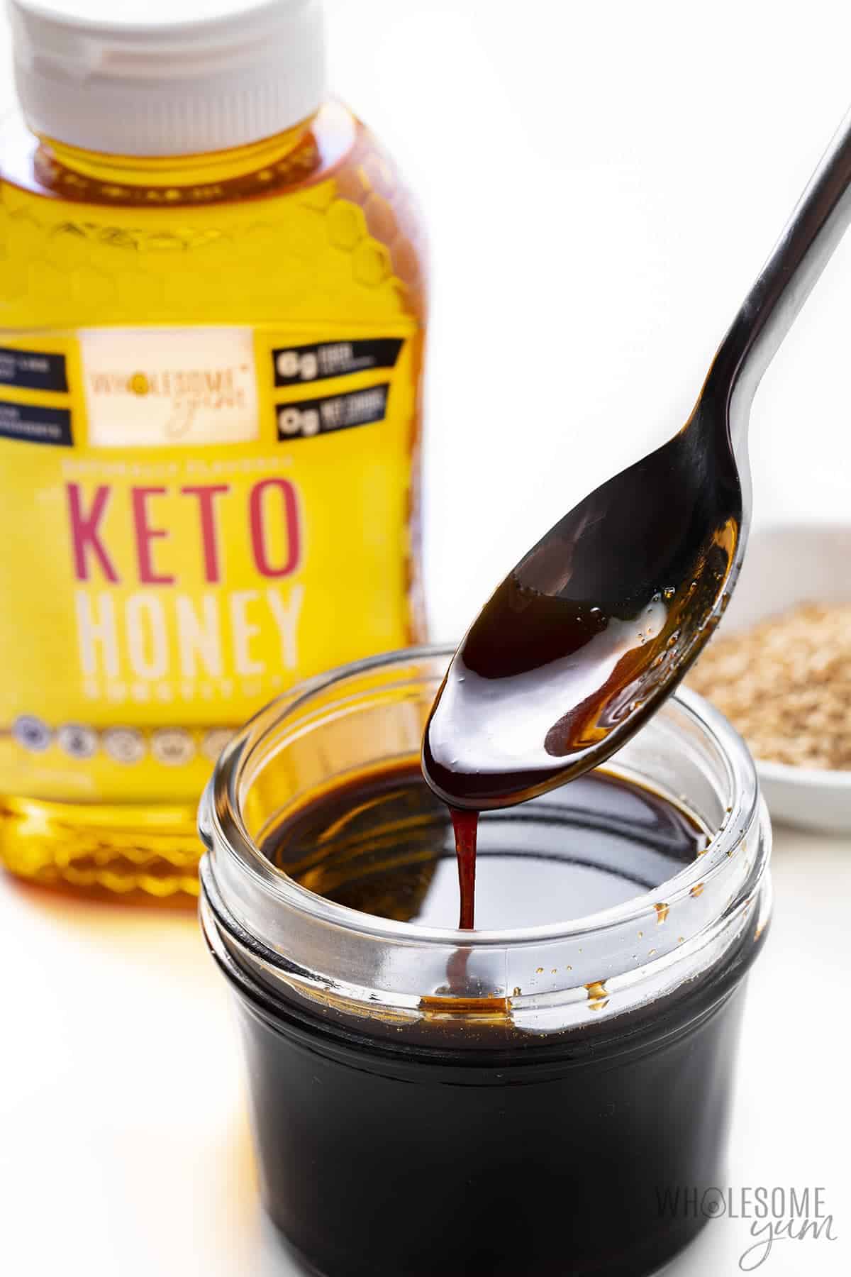 Low carb teriyaki sauce with a spoon and keto honey.