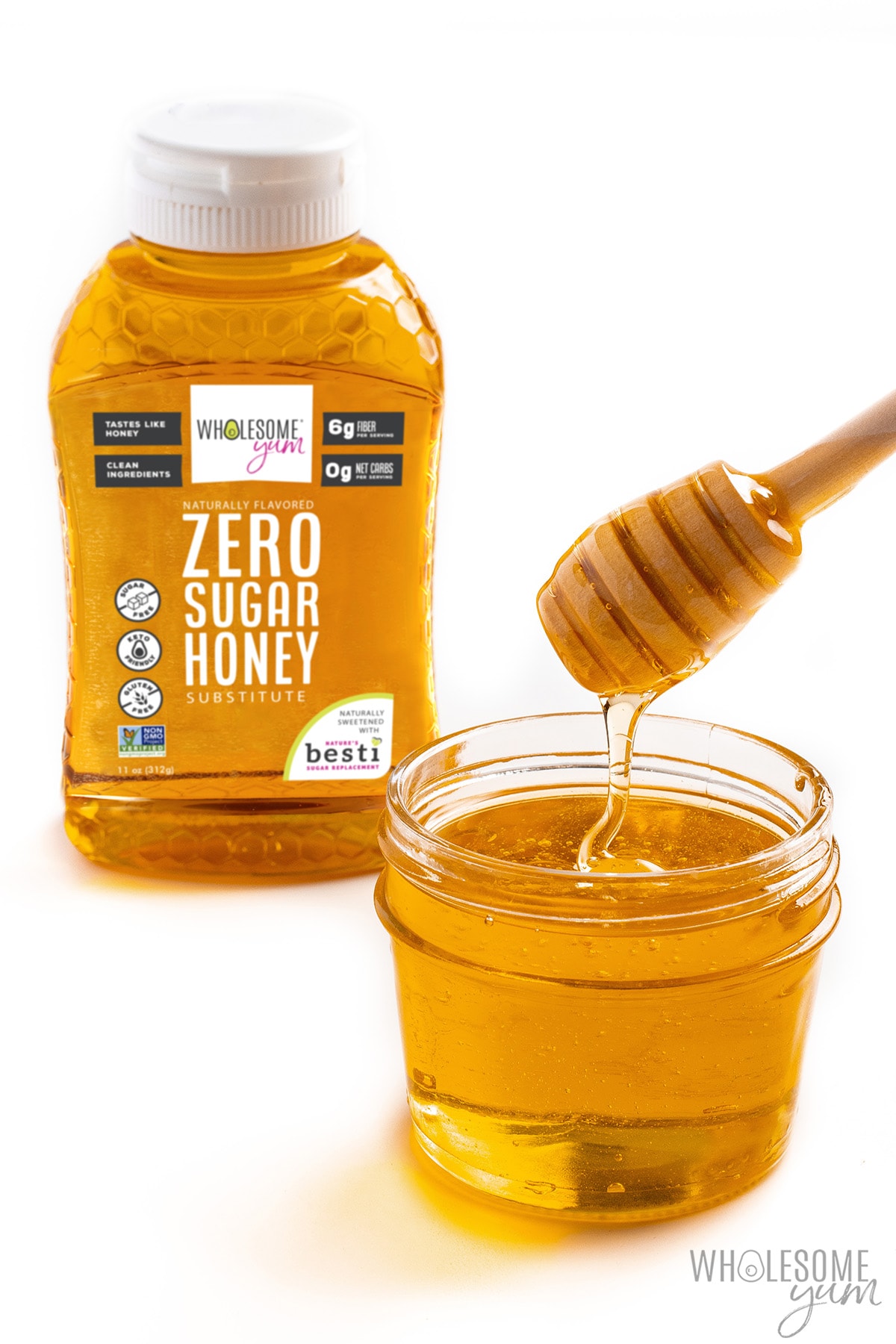 Zero sugar honey dripping from a honey stirrer into a jar.