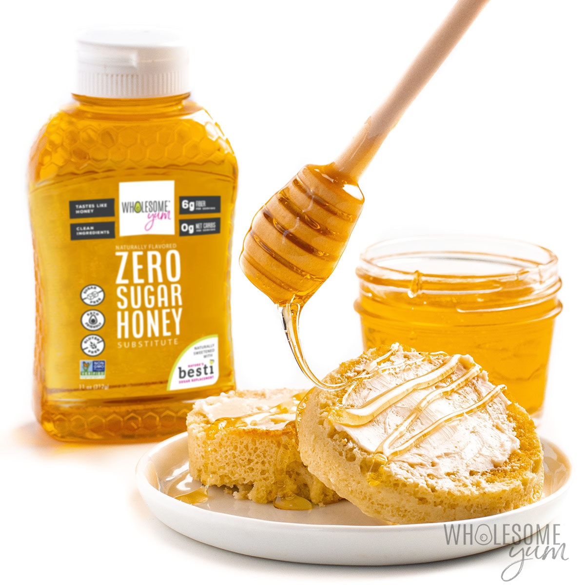 Honey stirrer drizzling keto honey substitute over a low carb English muffin.