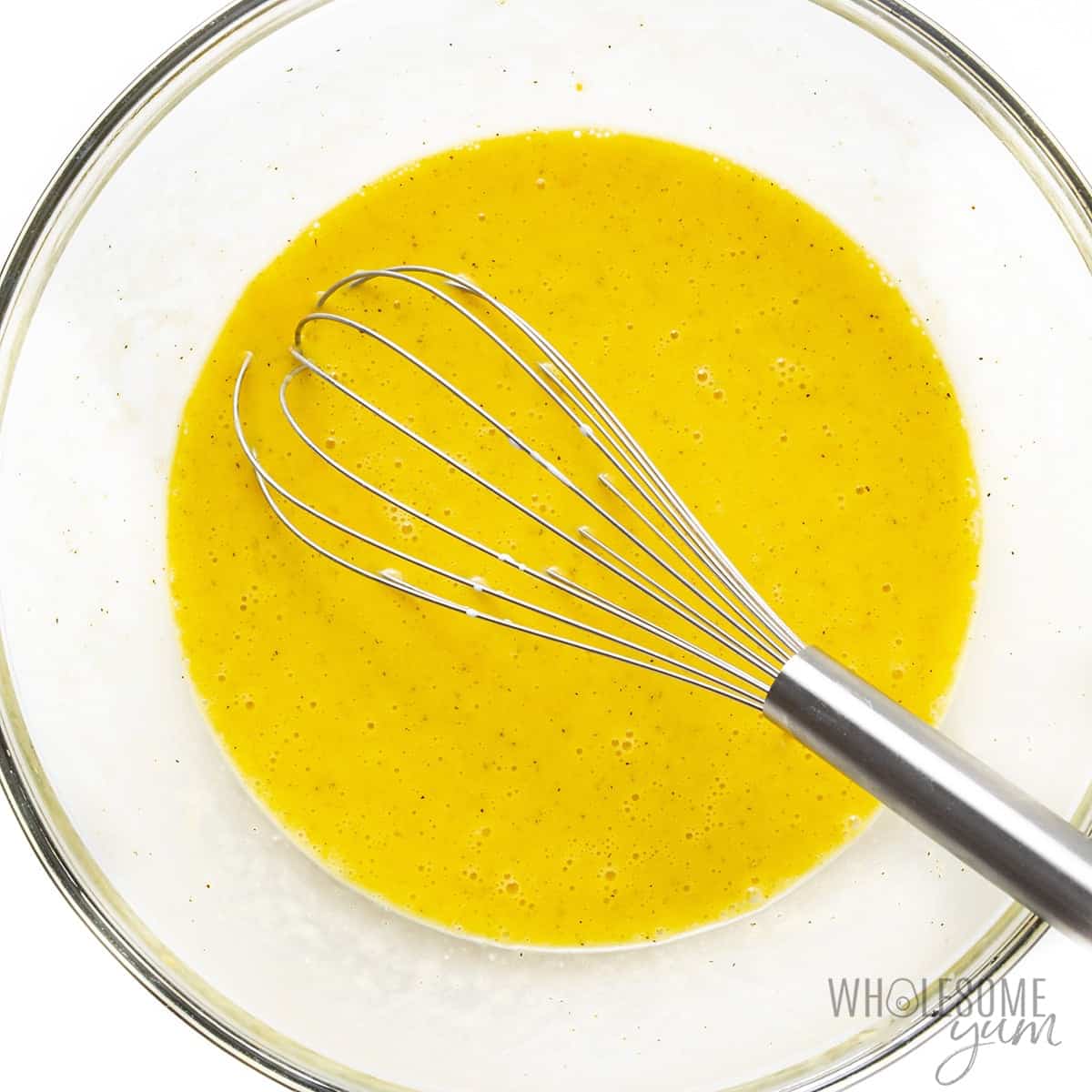 Whisked eggs in a bowl.
