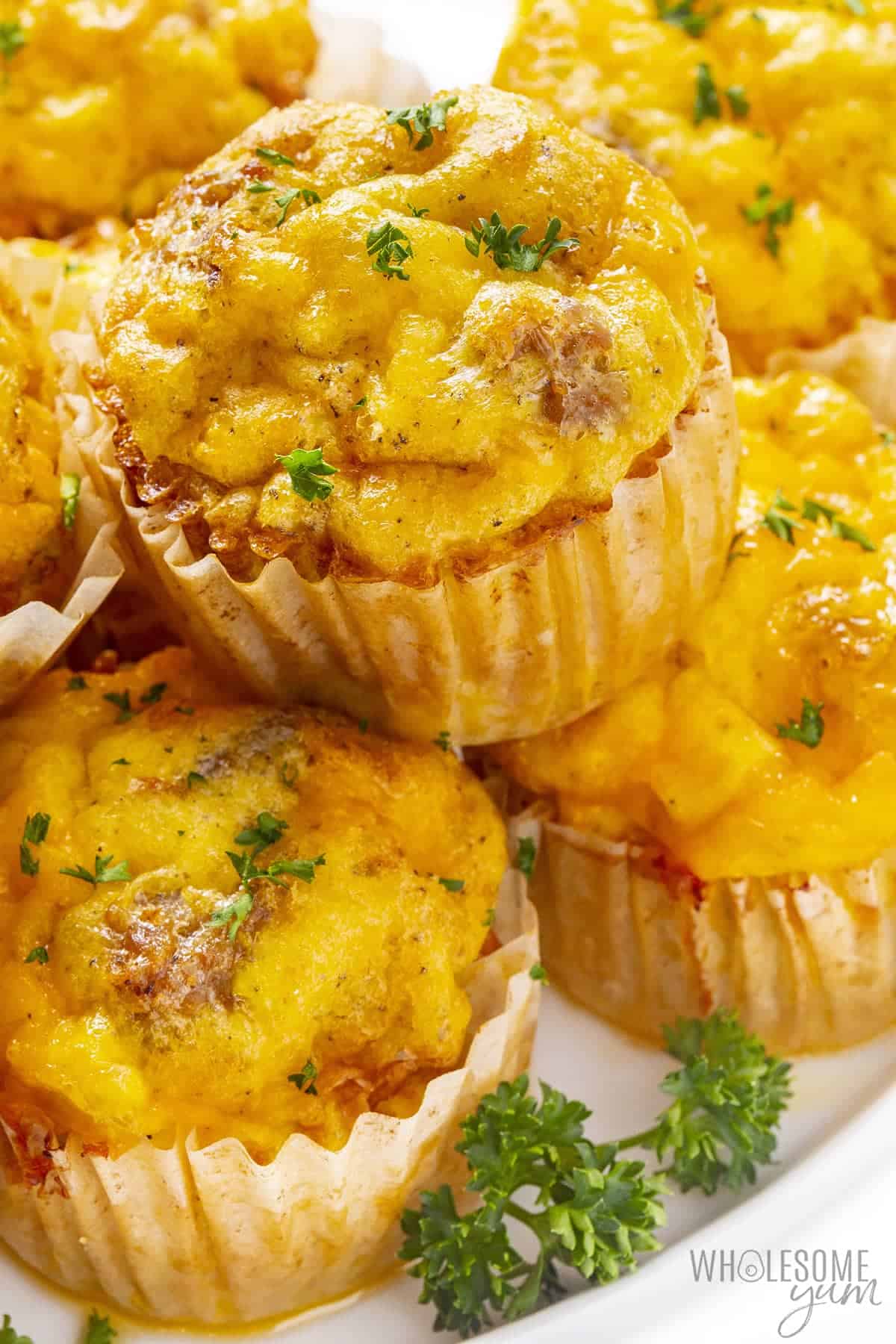 Egg muffins with sausage on a plate.