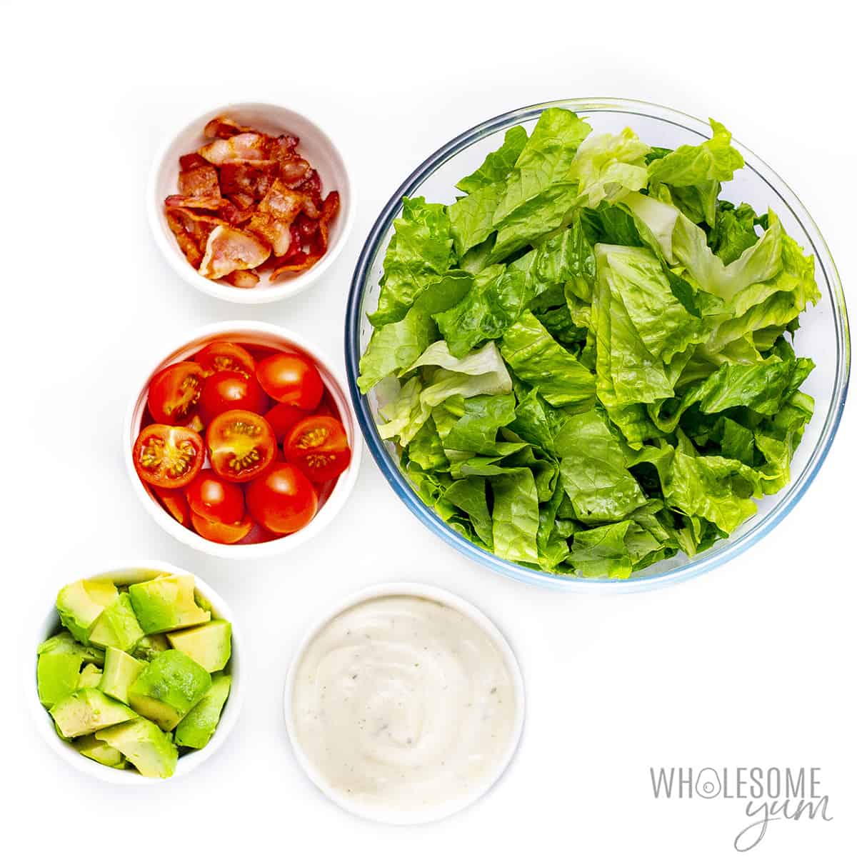 Salad ingredients in bowls.