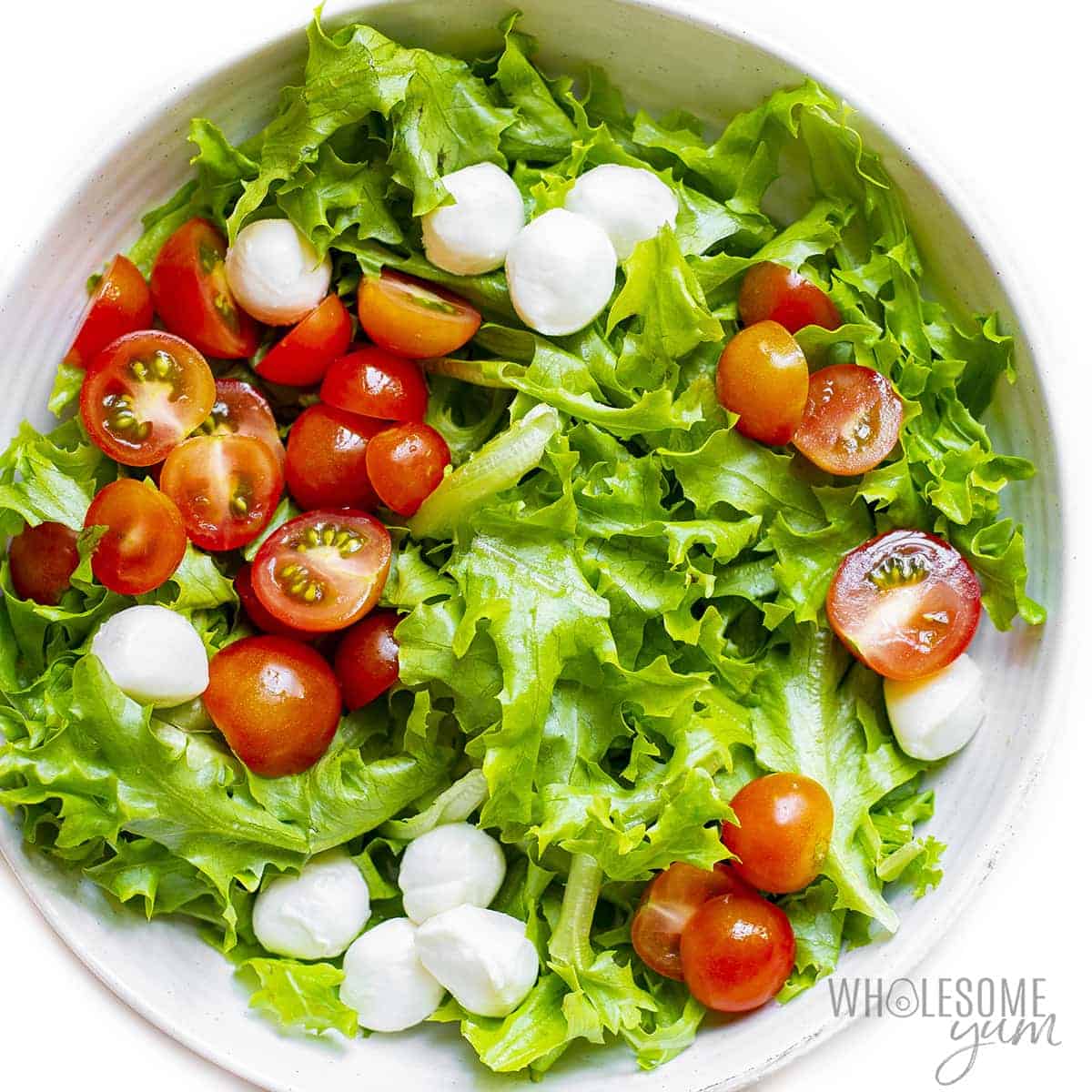 Salad ingredients without chicken in a bowl.