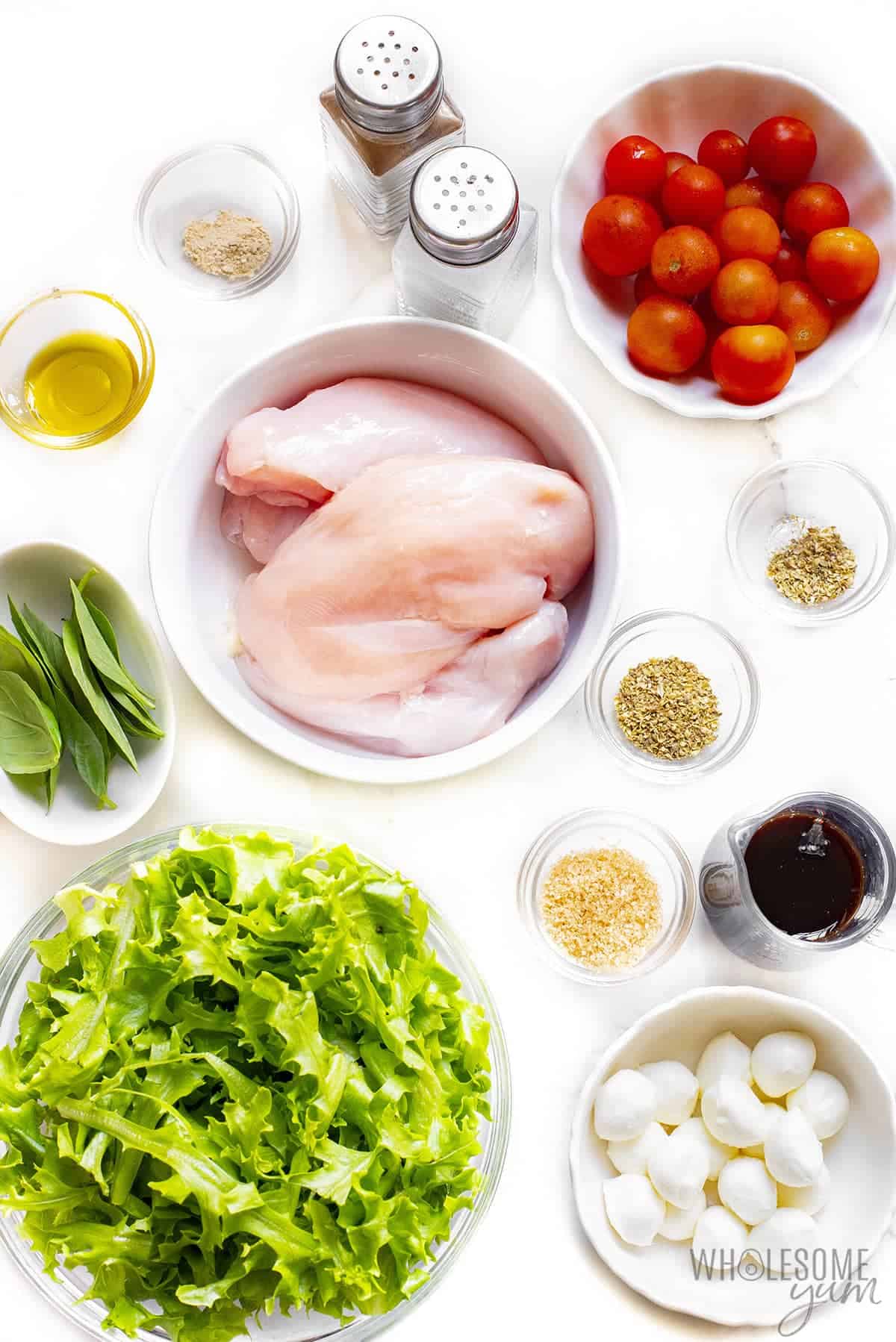 Chicken caprese salad ingredients in bowls.