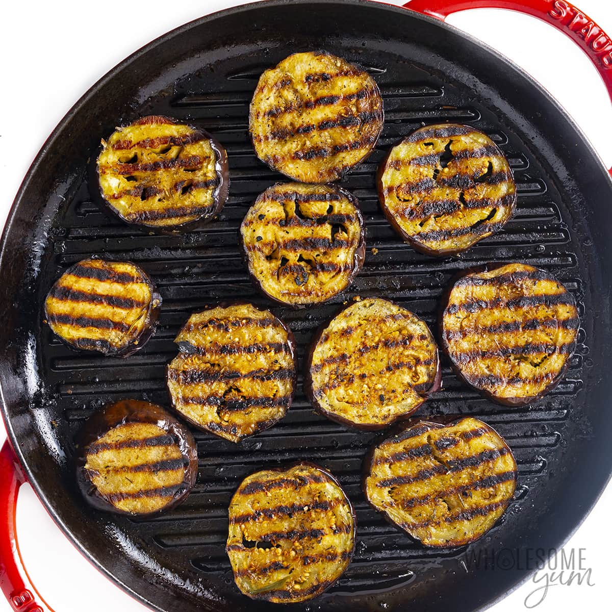 Eggplant on the grill with grill marks.