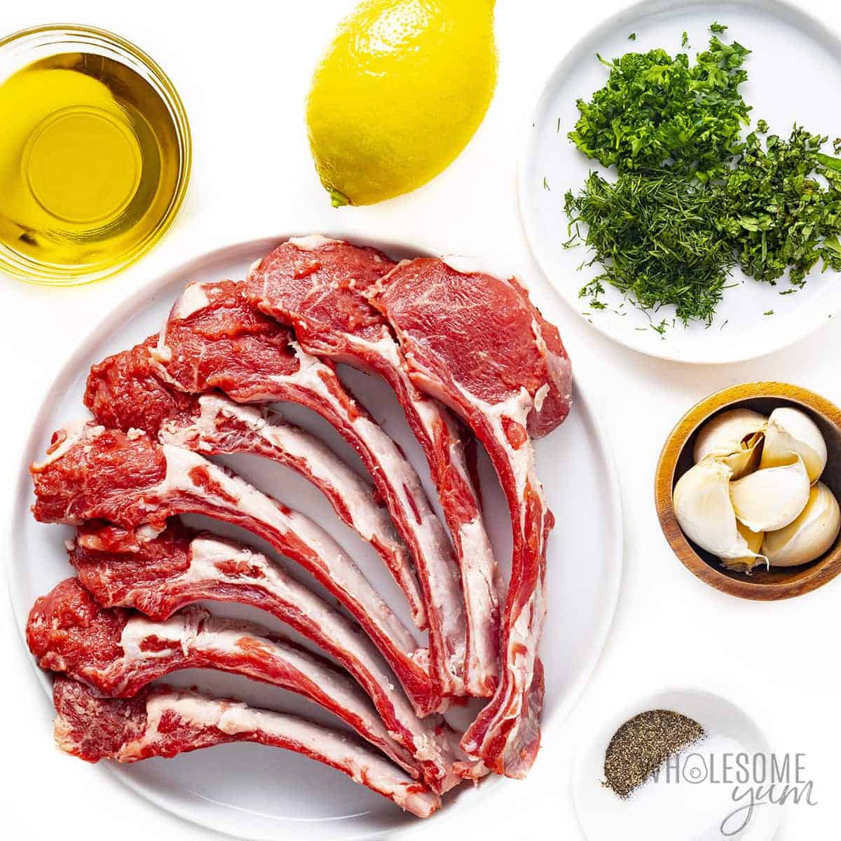 Ingredients for how to grill lamb chops on plates.