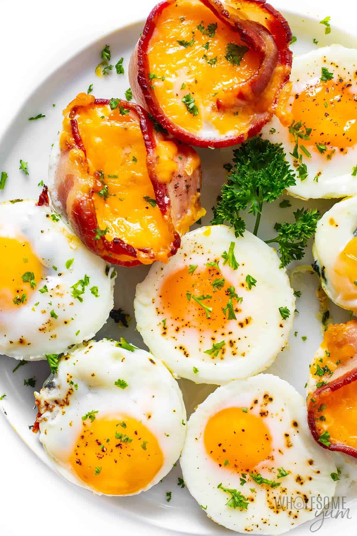 Oven baked eggs on a plate with garnish.