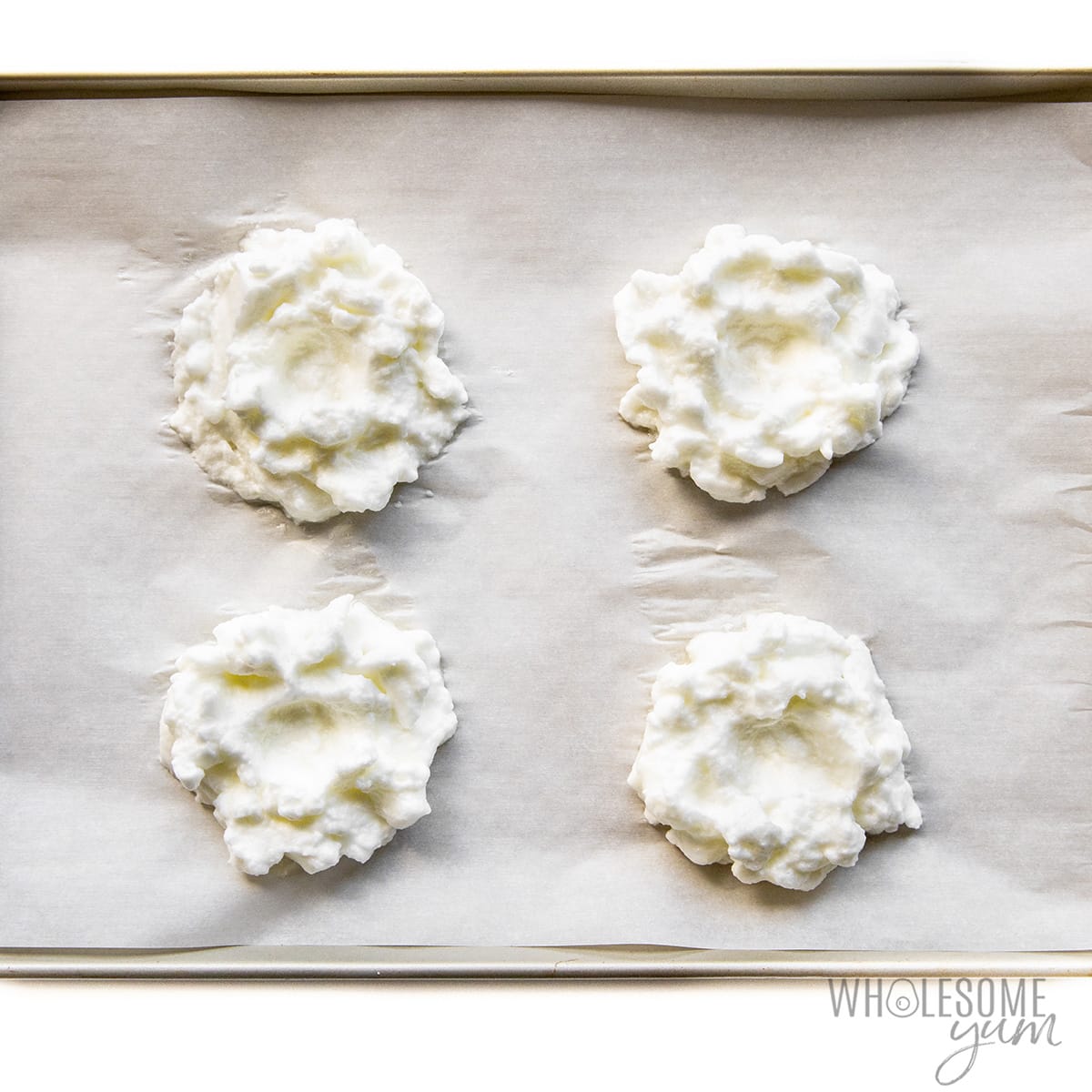 Whipped whites on a baking sheet.