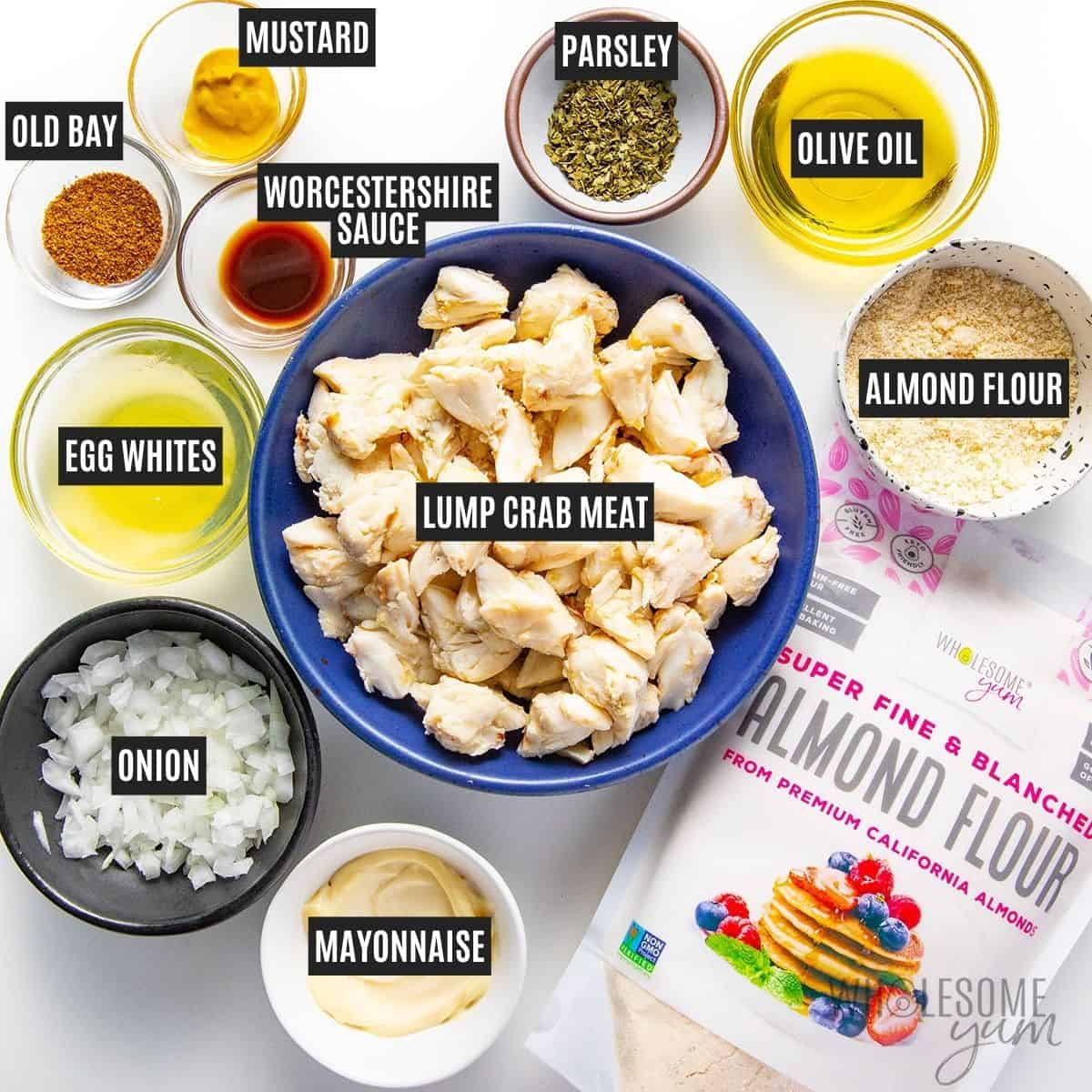 Labeled recipe ingredients: Lump crab meat, onion, almond flour, egg whites, mayonnaise, Worcestershire sauce, mustard, dried parsley, Old Bay seasoning, and olive oil.