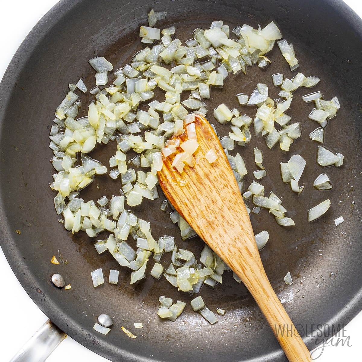 Onions cooked in a pan.