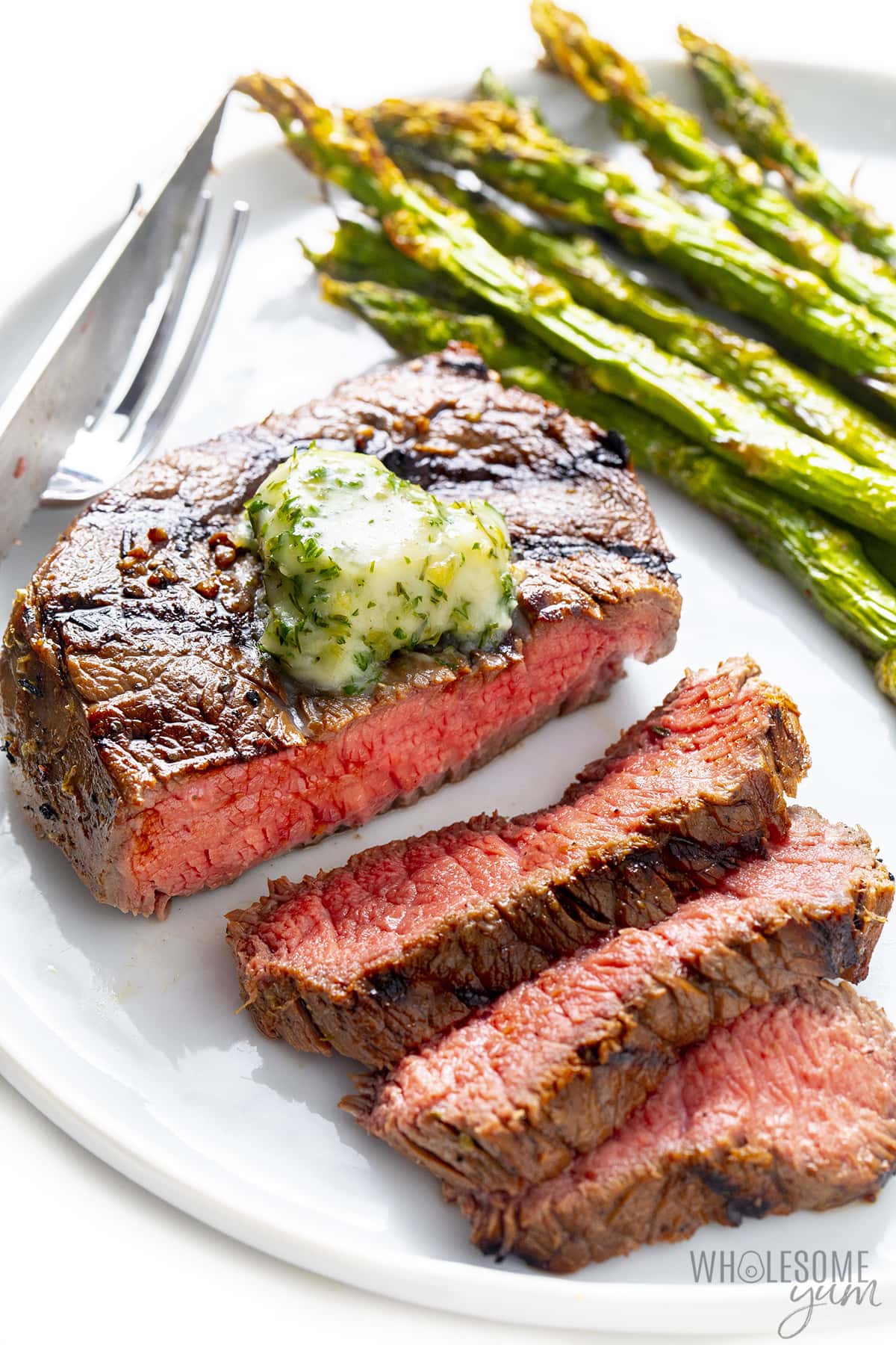 Best grilled steak plated with asparagus.