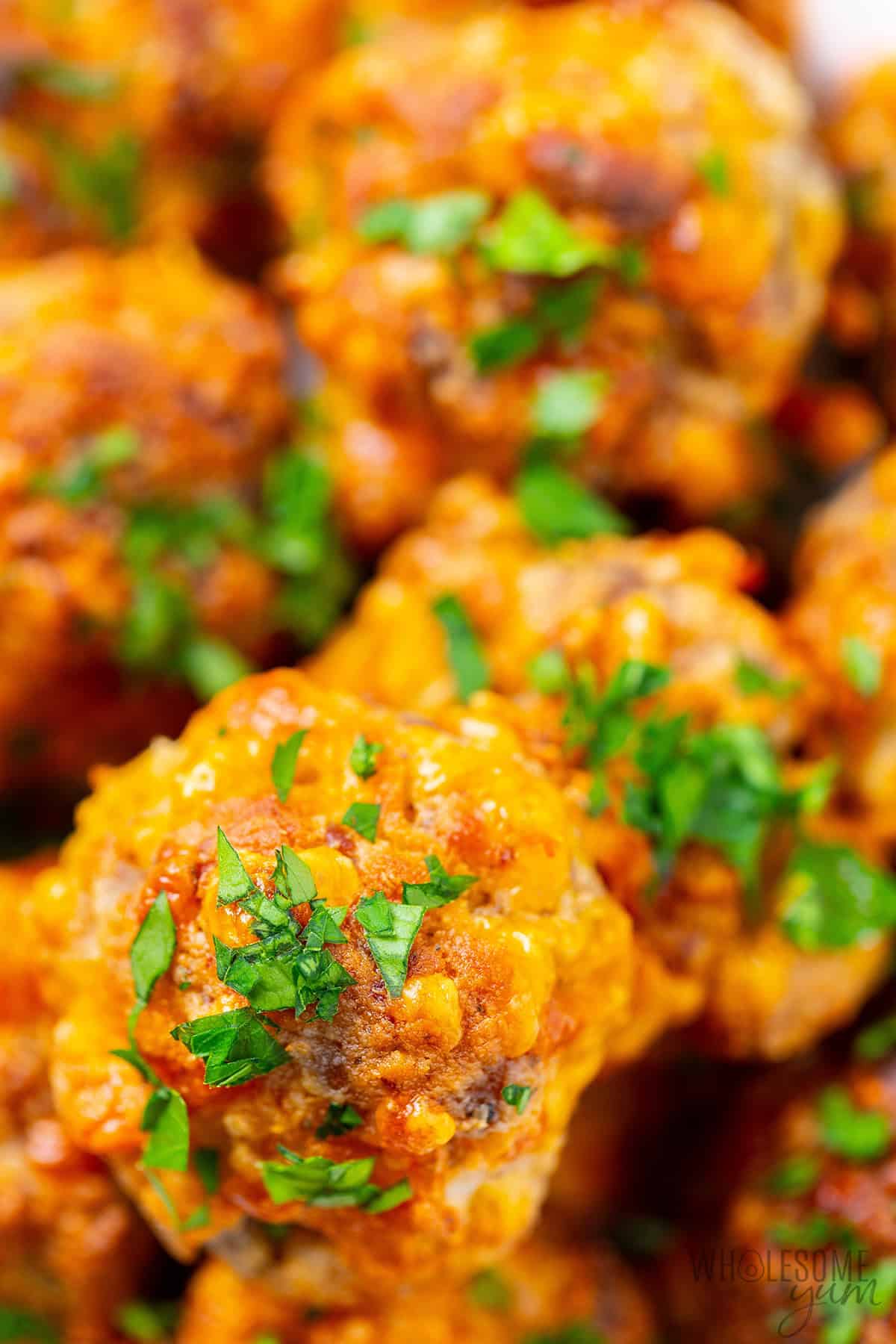 Cheesy, tender sausage balls close up.
