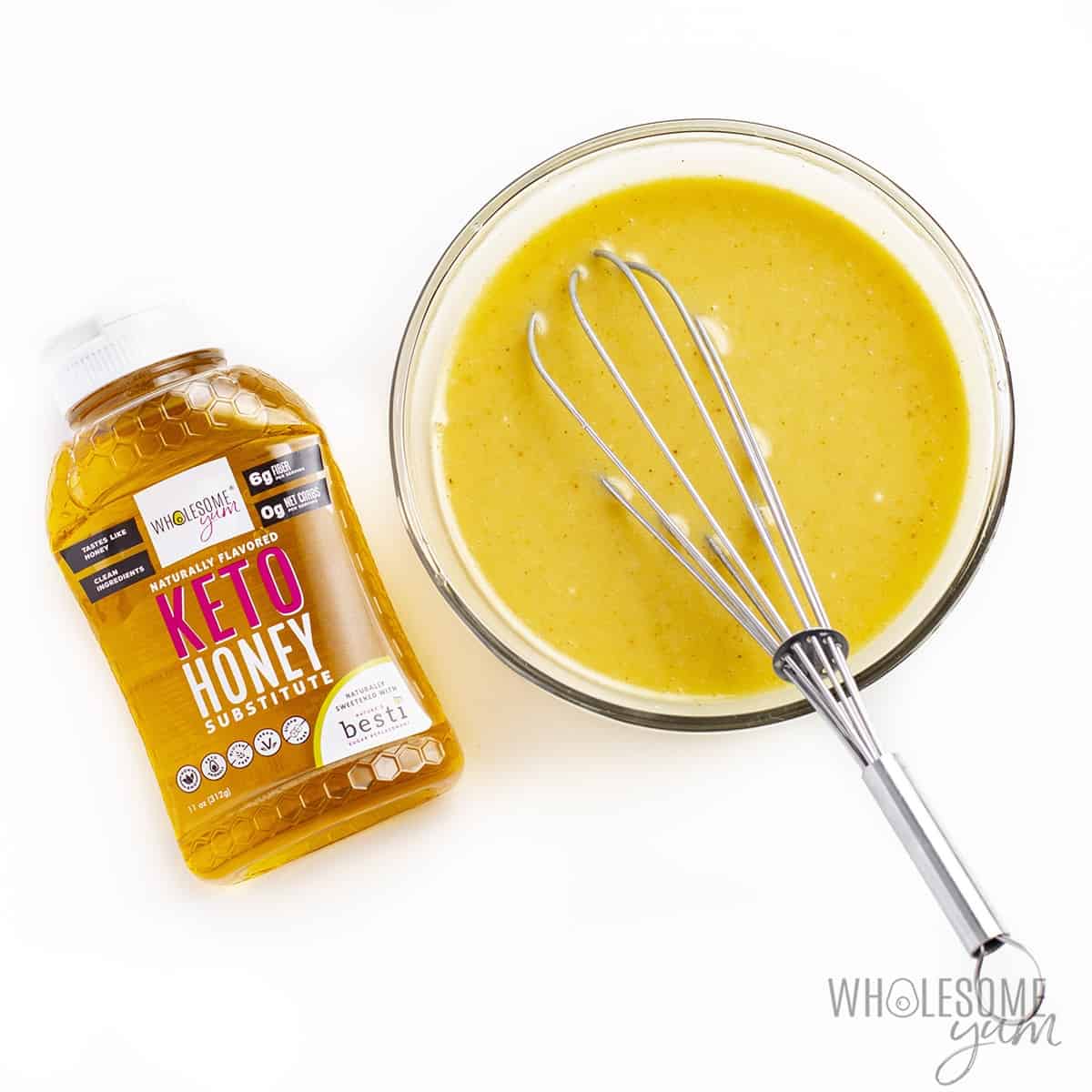 Keto honey mustard whisked together in a bowl.