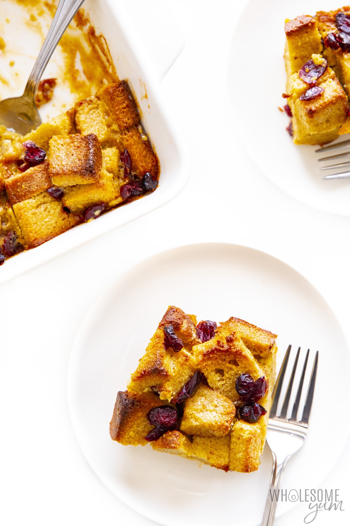 Serve the keto bread pudding on a plate with a fork next to the baking sheet.