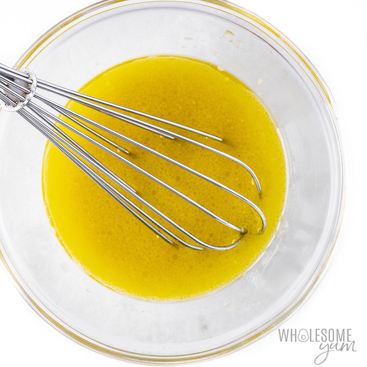 Salad dressing whisked in a bowl