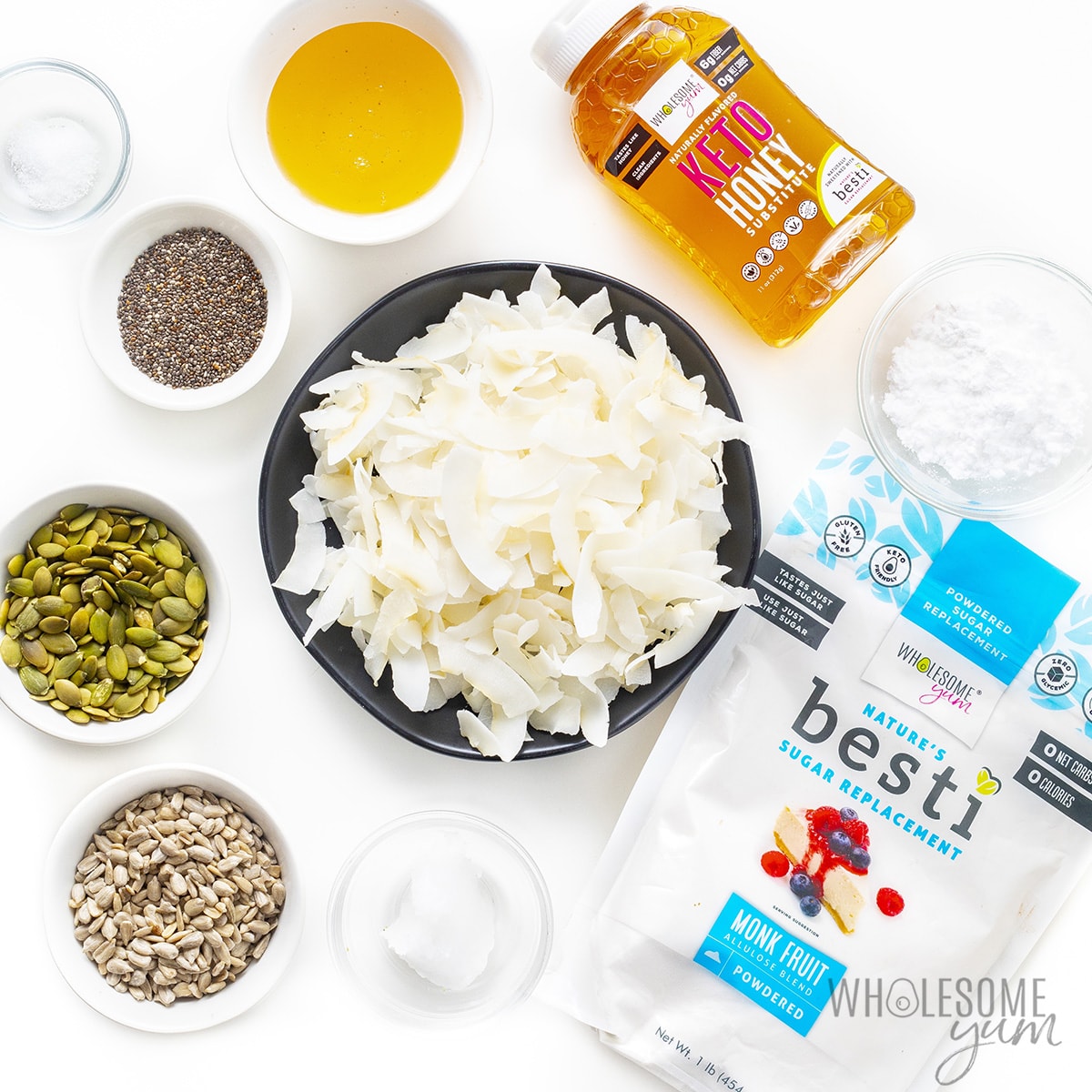 Ingredients for keto coconut clusters in separate bowls.