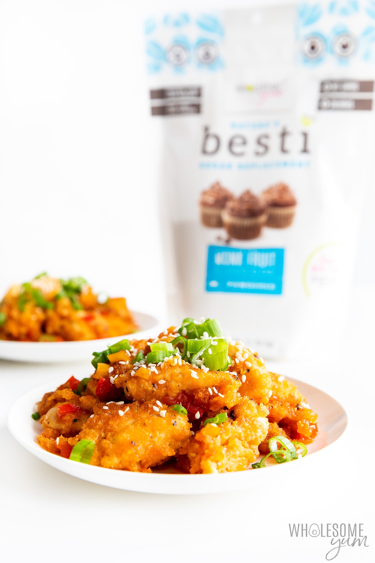 Plate of healthy sweet and sour chicken with bag of Besti.