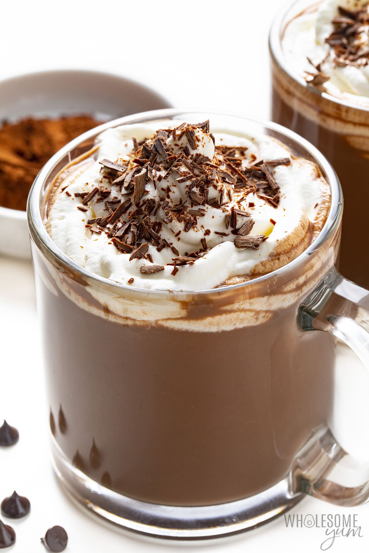 Sugar-free hot chocolate in mugs with whipped cream and chocolate shavings.