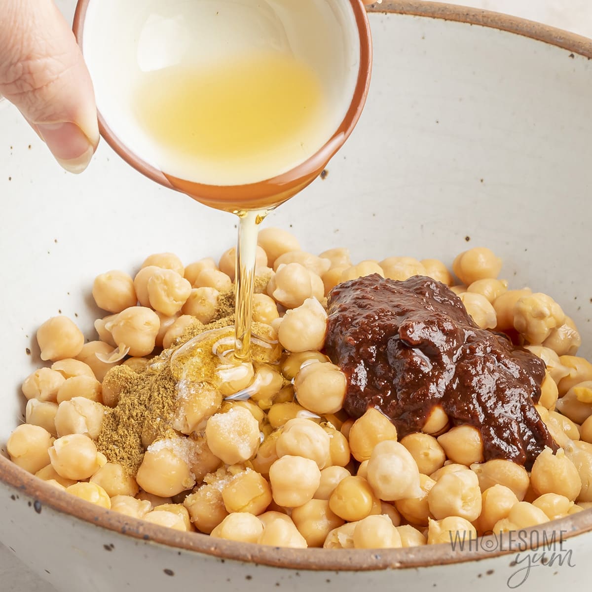 Chickpeas with spices poured over the top.