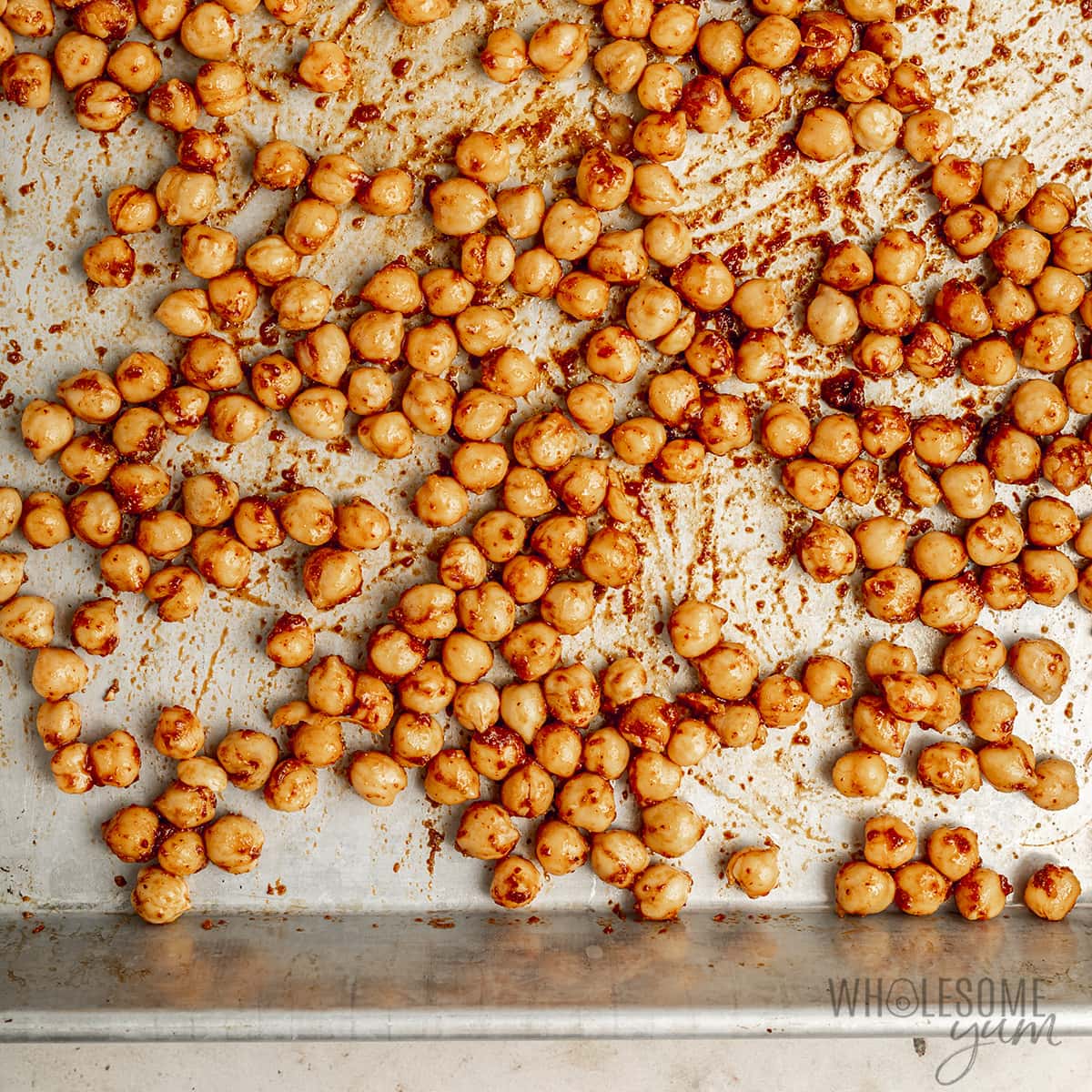 Chickpeas on a sheet pan in a single layer.