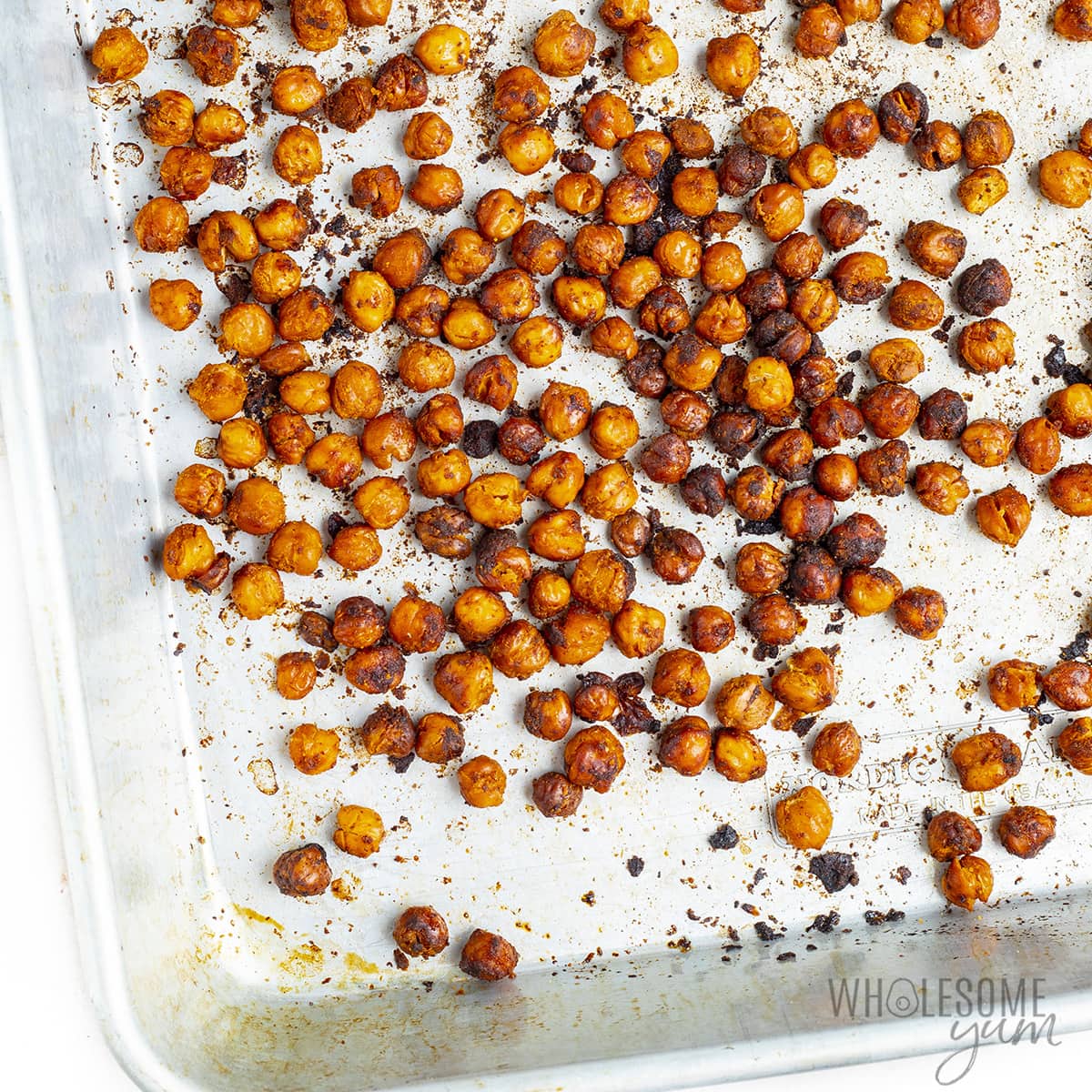Roasting chickpeas completed on a sheet pan.