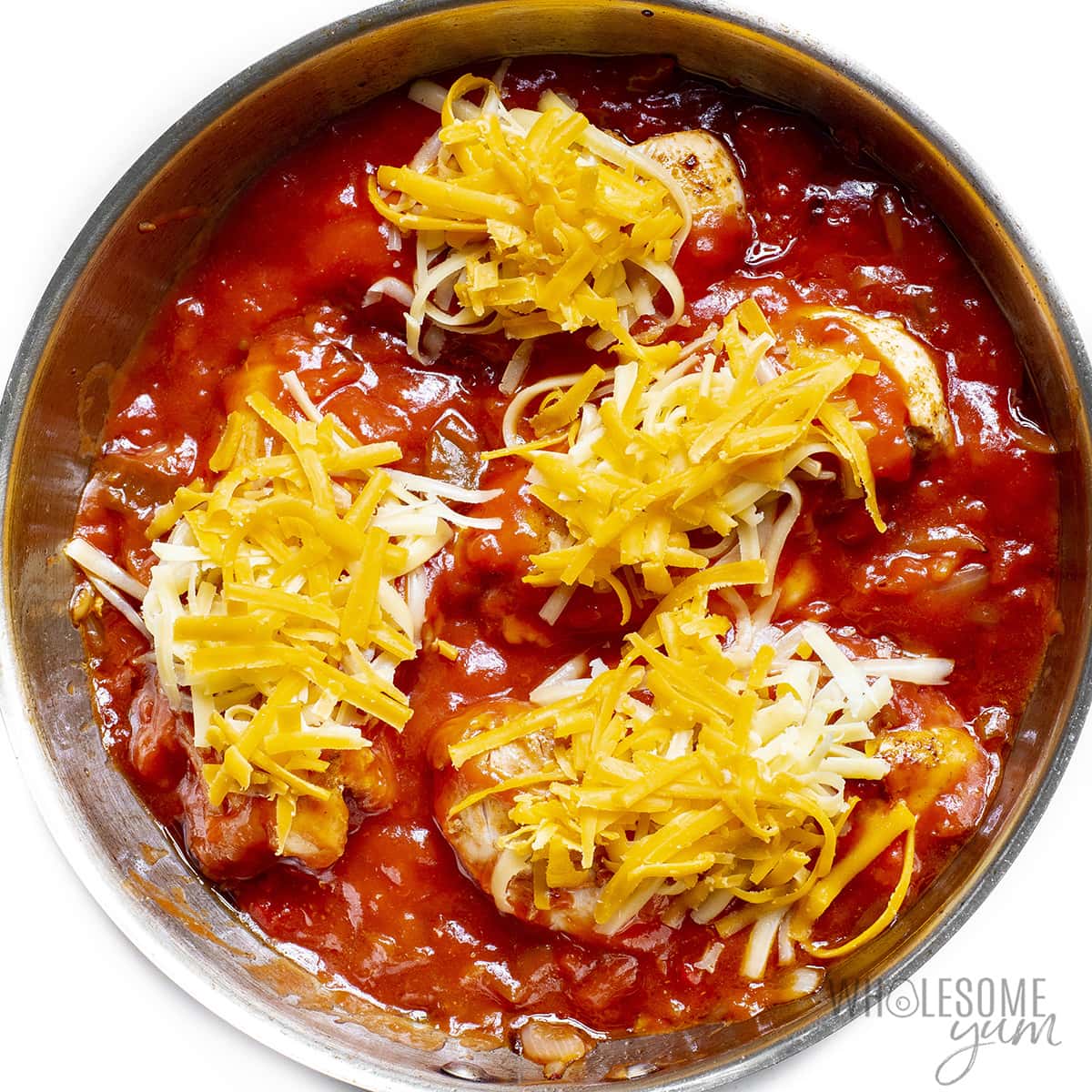Chicken with salsa and cheese.