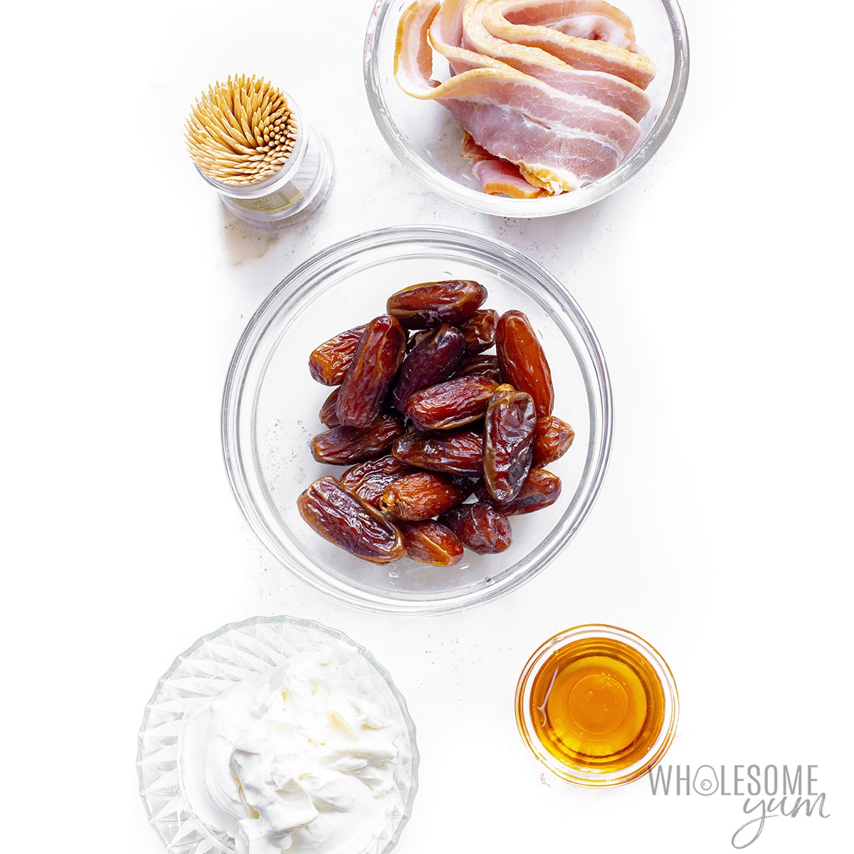 Bacon wrapped dates recipe ingredients in bowls.