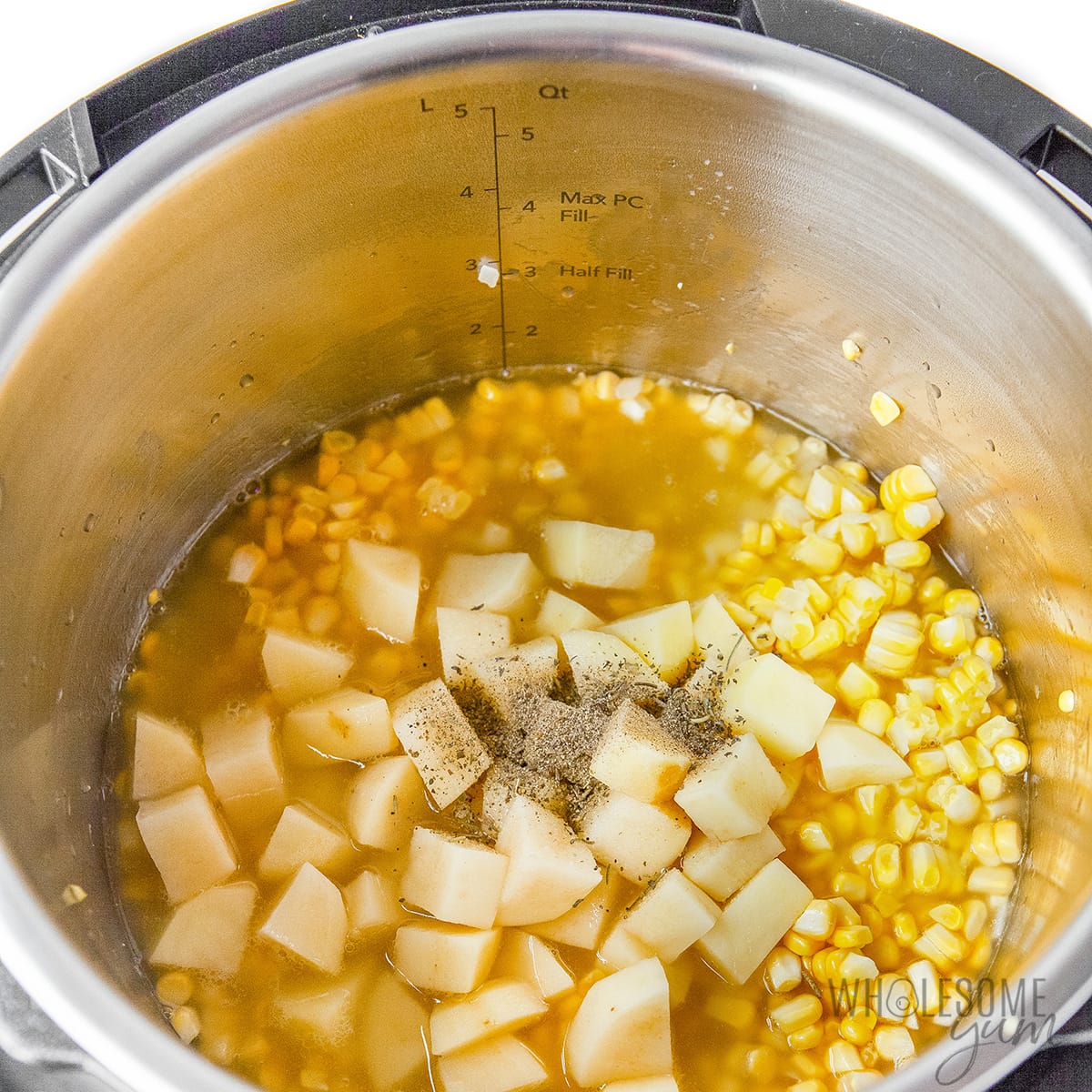 Corn with potatoes, broth, and seasonings added.