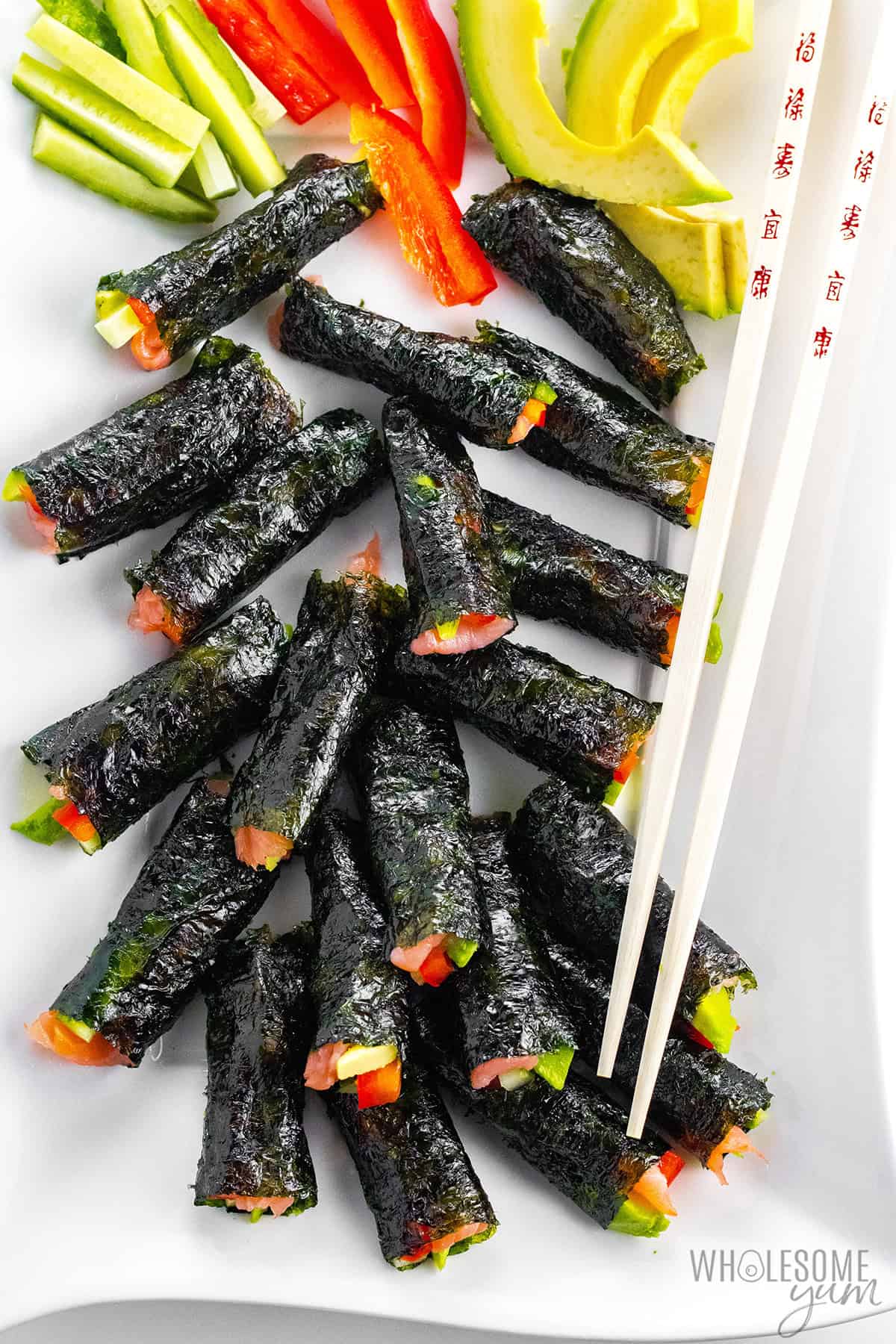 Keto sushi rolls with chopsticks.