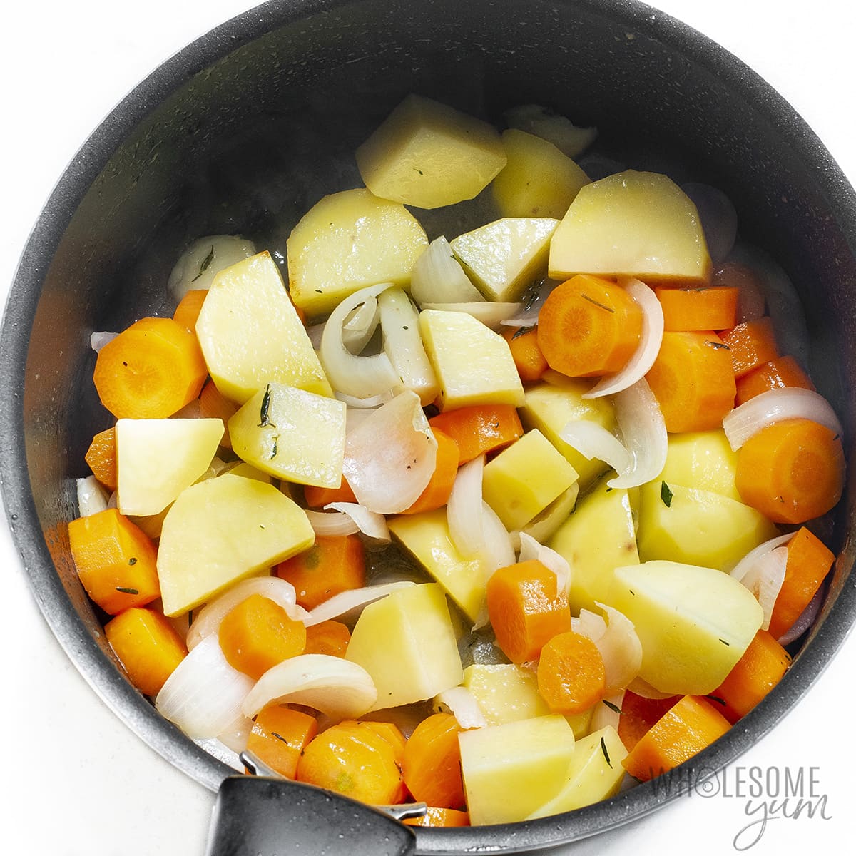 Vegetables cooking in pot.