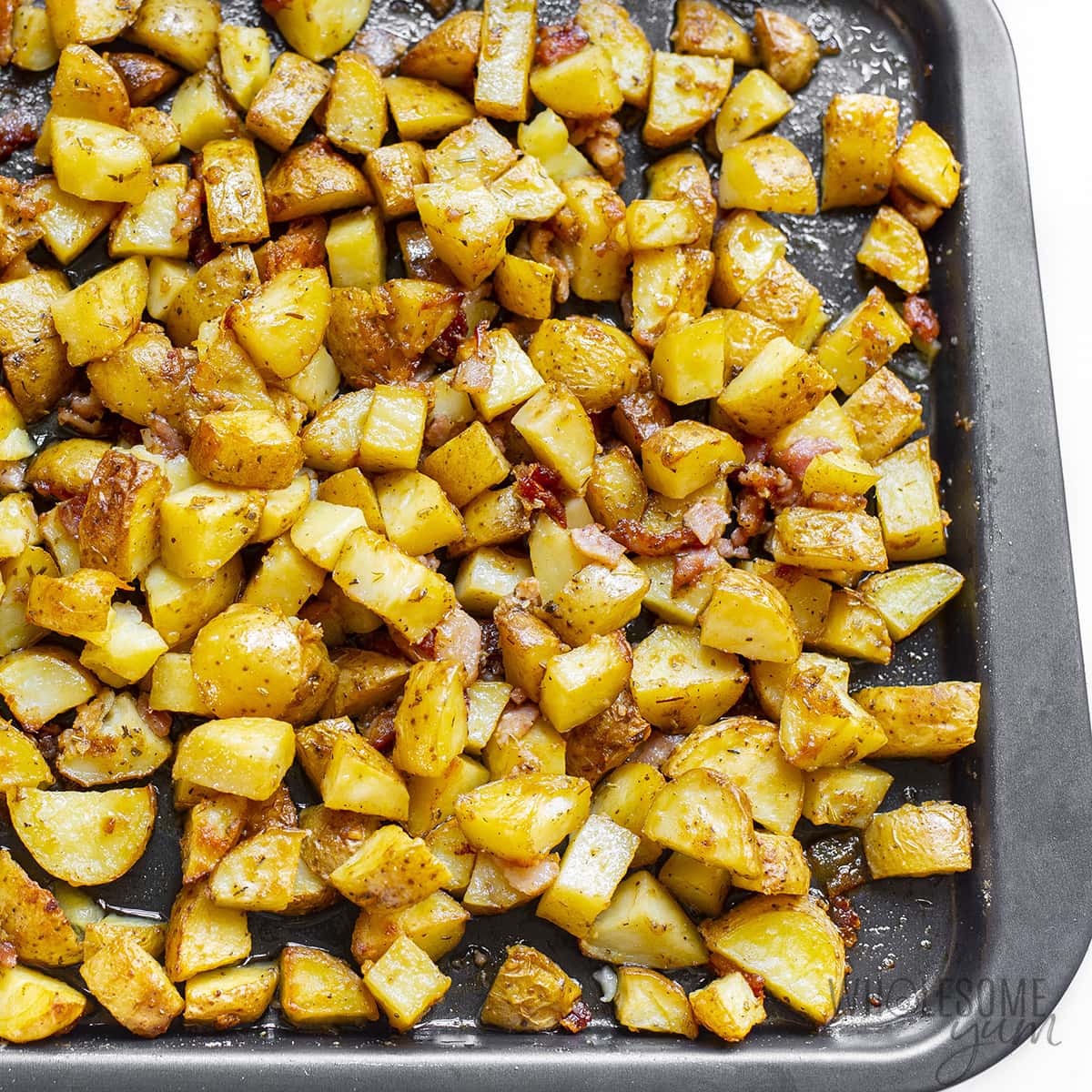 Oven roasted potatoes finished on baking pan.