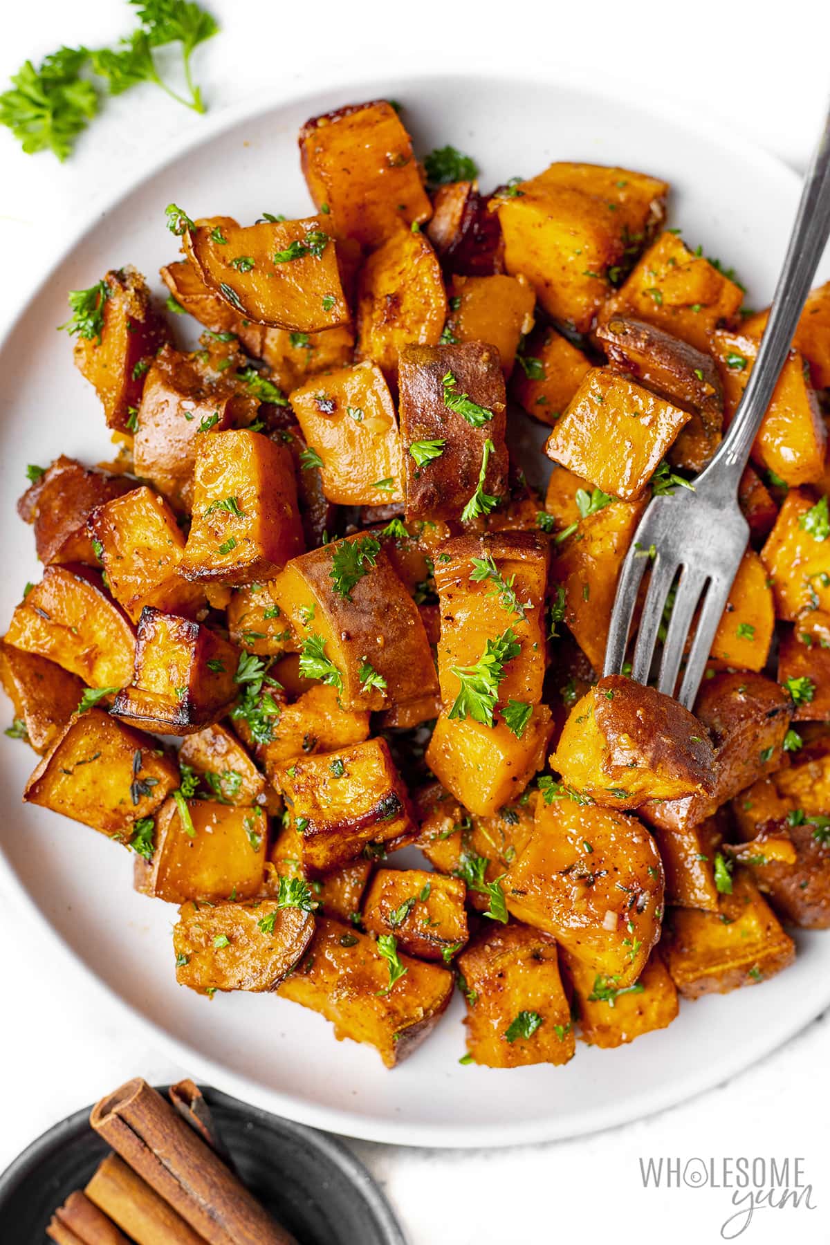 Full plate of roasted sweet potato cubes.