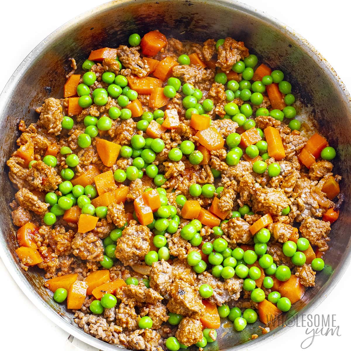 Add peas to shepherds pie in skillet.