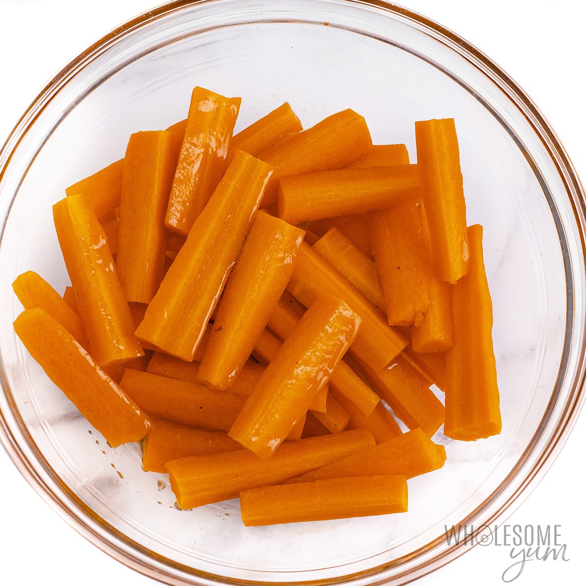 Carrots tossed in marinade.