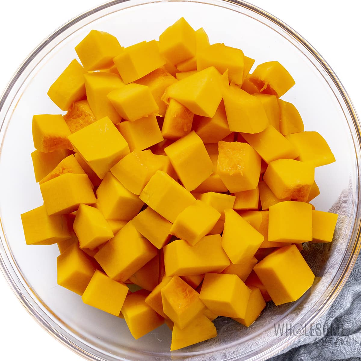 Cubes of squash in a bowl.