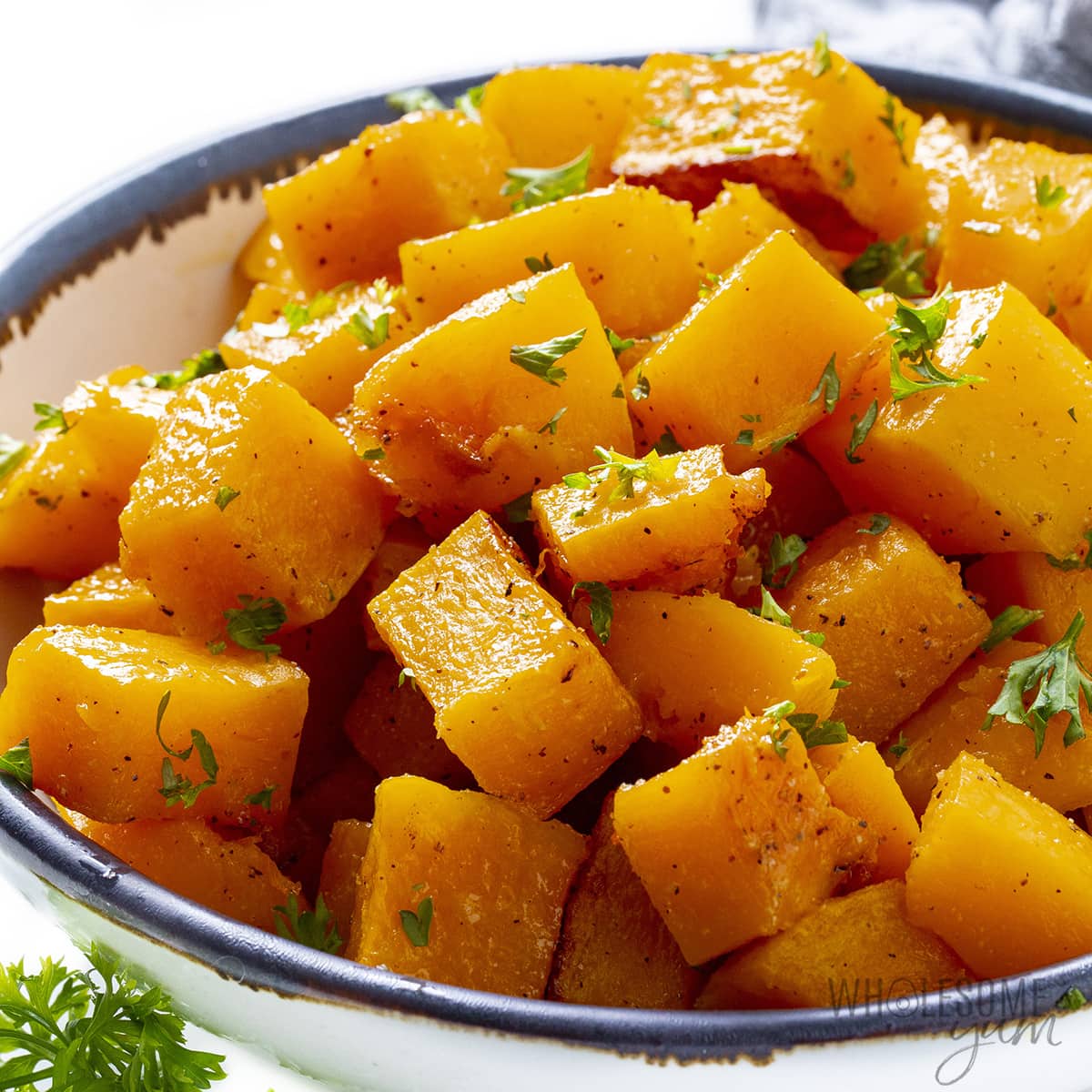 Roasted butternut squash piled into a bowl.