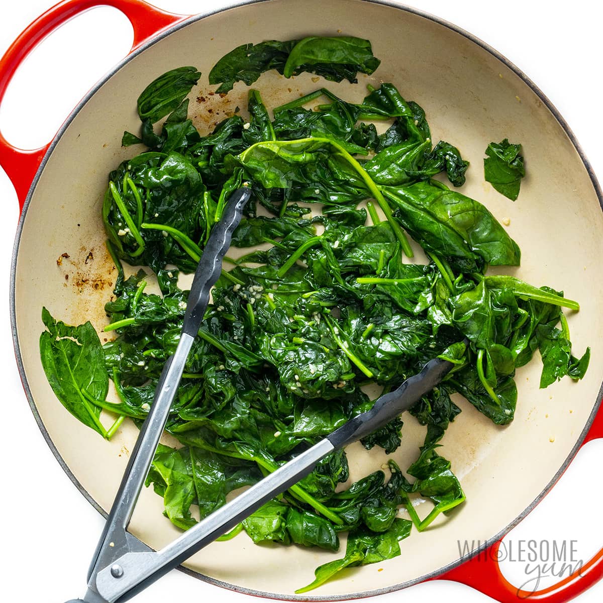 Spinach wilted in skillet.