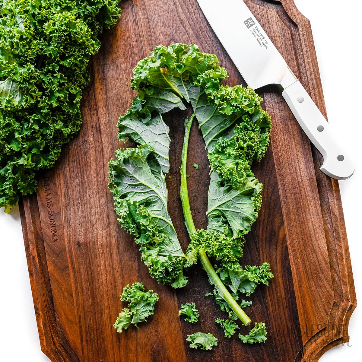 Washed kale on cutting board. 