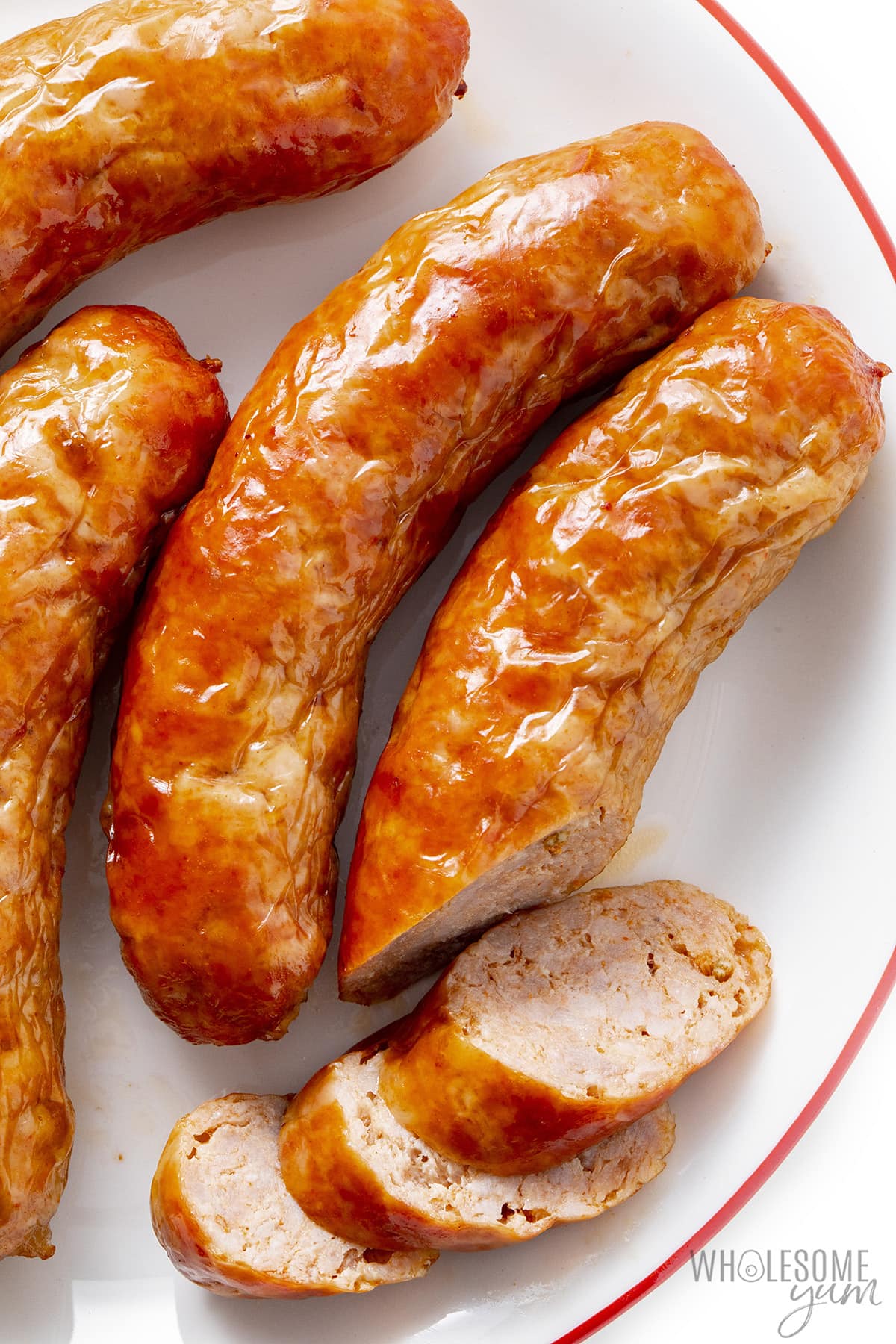 Sliced ​​air fryer sausages on a plate.